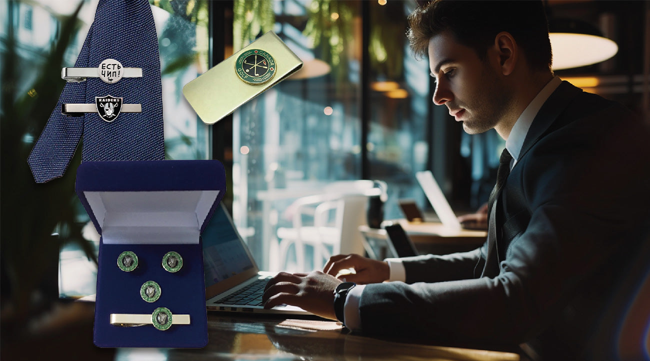 Custom tie clips and cufflinks with engraved text, worn by a professional man in a suit while working on a laptop in a bright office setting.