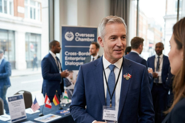 Patriotic Lapel Pins Worn at Overseas Chamber Cross-Border Enterprise Dialogue International Business Networking Event Featuring Custom Logo For Global Partnership and Professional Identity Recognition