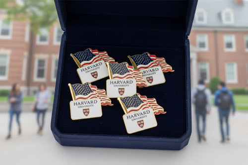 Patriotic Lapel Pins with Glossy American Flag and Harvard University Crest Design Displayed in Velvet-Lined Case Against Blurred Harvard Campus Background For Institutional Pride and Alumni Recognition