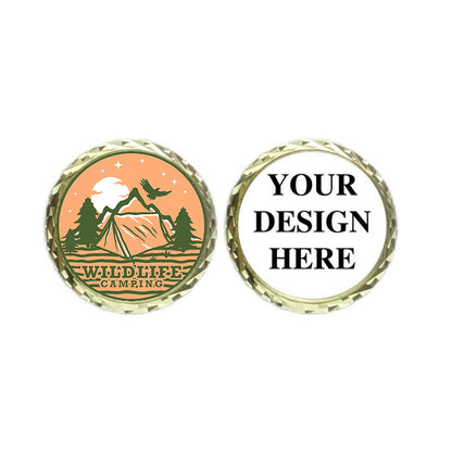Personalized challenge coin with an orange front depicting a wildlife camping scene and text "WILDLIFE CAMPING", and a white back showing "YOUR DESIGN HERE" for adding designs.