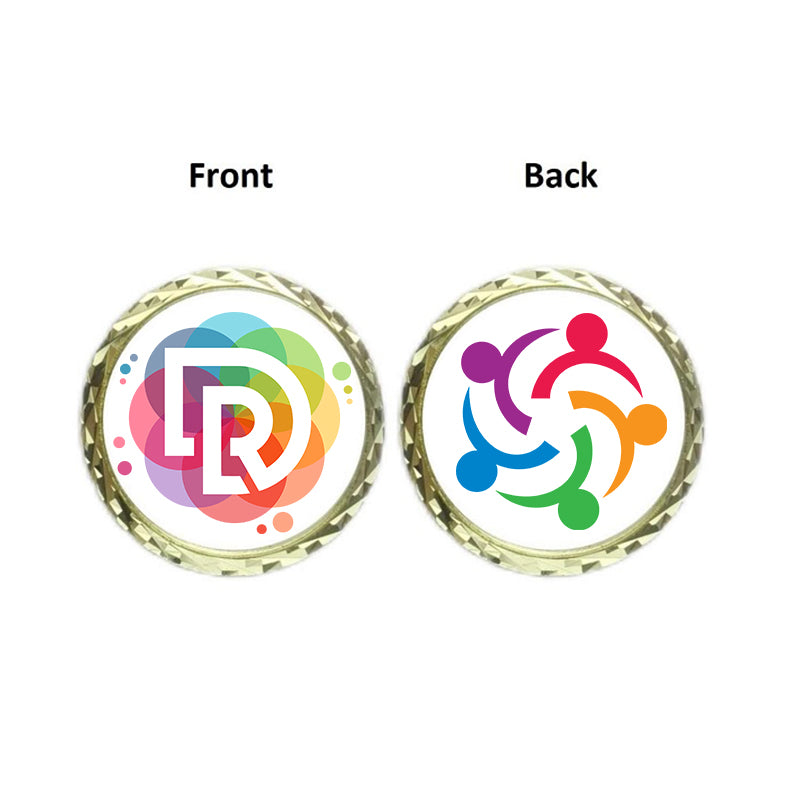 Diagram showing the front and back of a commemorative coin. The front features a "DR" logo within a colorful, multi-hue ring, and the back shows four colored figures (purple, red, blue, green) holding hands in a circle.