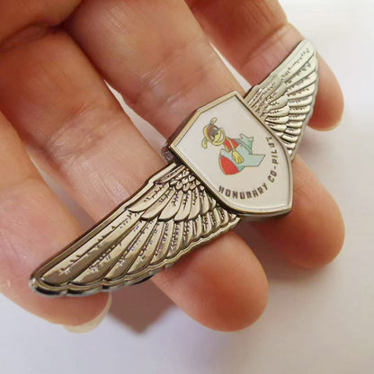 Custom aviator wing insignia in black nickel finish, ideal for flight school graduation pinning ceremonies and aviation corporate branding.