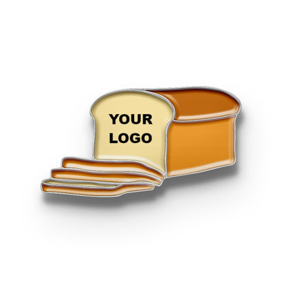 A metal pin designed to look like a piece of toasted bread with a placeholder for a custom logo