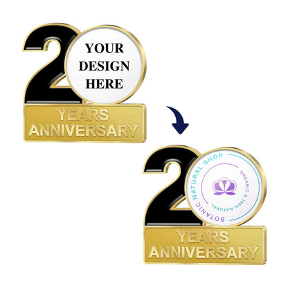 Anniversary Pins in Gold Featuring a Before-And-After Customization Layout With Black Number 20 and Gold YEARS ANNIVERSARY Bar Showcasing Transition From YOUR DESIGN HERE Template to Applied Botanic Natural Shop Floral Logo and Text For Custom Brand Commemoration