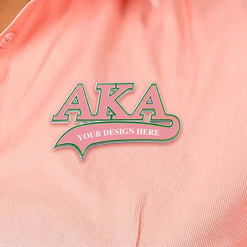 Custom AKA silver lapel pin pinned on a pink shirt showing real-life wearing effect.