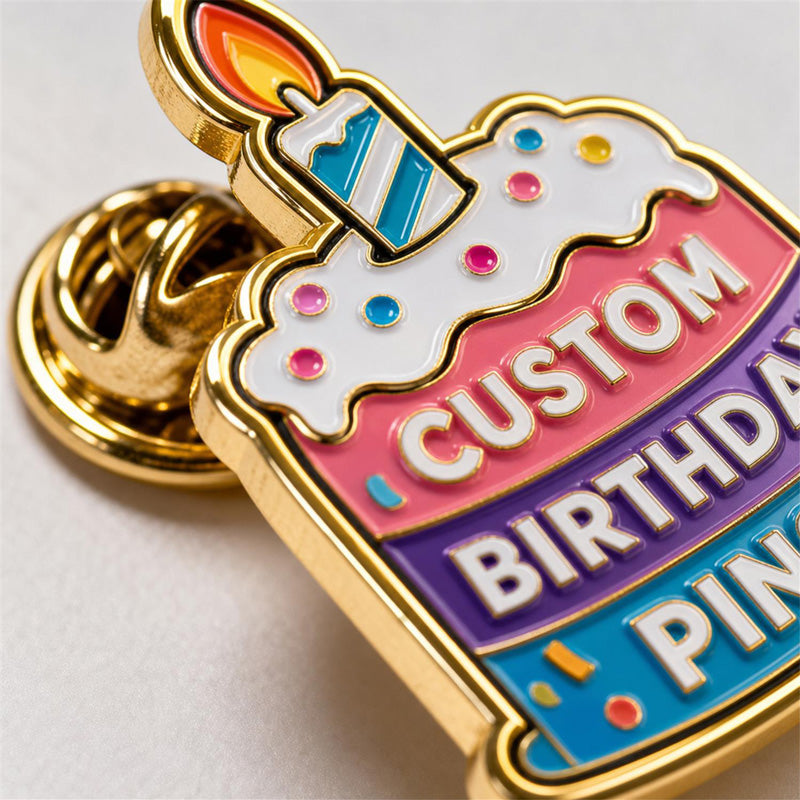 Close up of custom birthday pins with detailed enamel artwork, clean metal edges, and festive pin craftsmanship