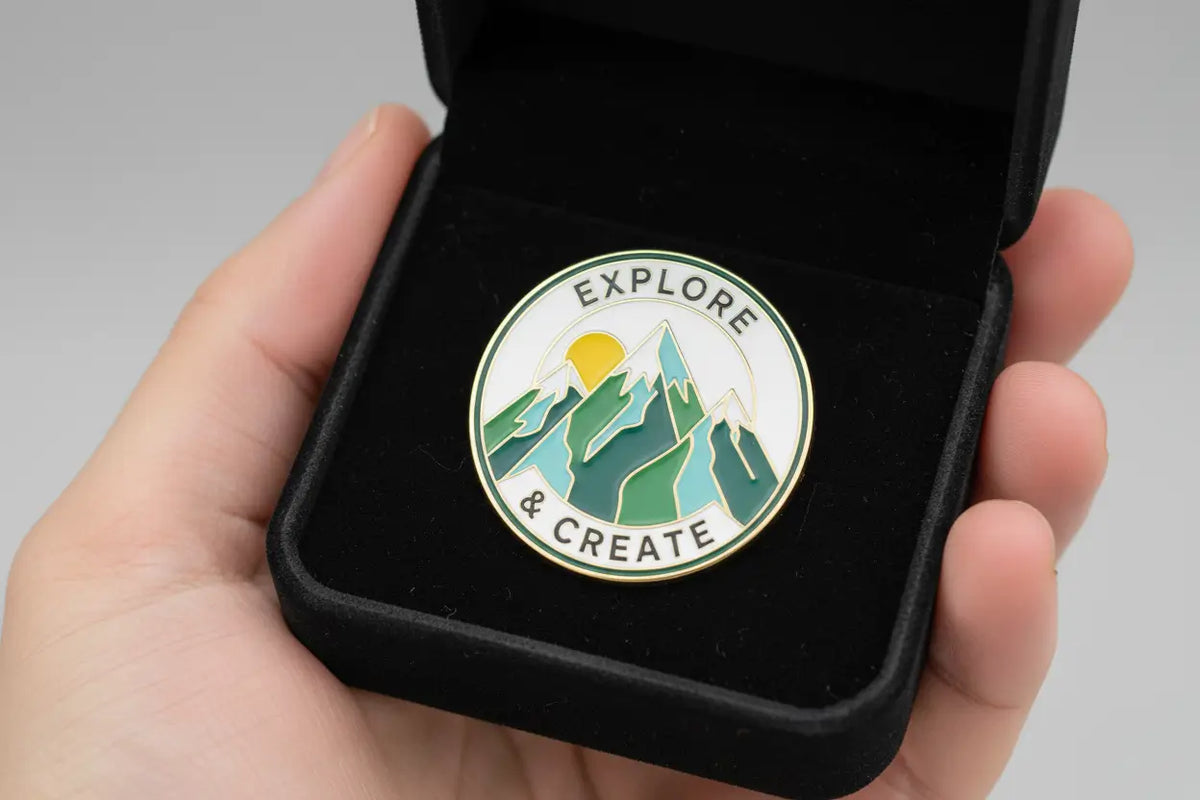 Custom lapel pin displayed in open gift box alongside branded kraft packaging