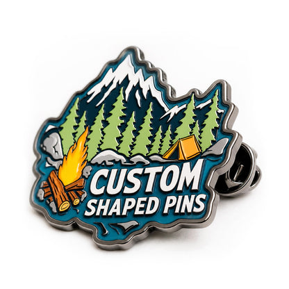 Close up of custom shaped pins showing detailed enamel artwork, clean edges, polished metal, and precise custom shapes