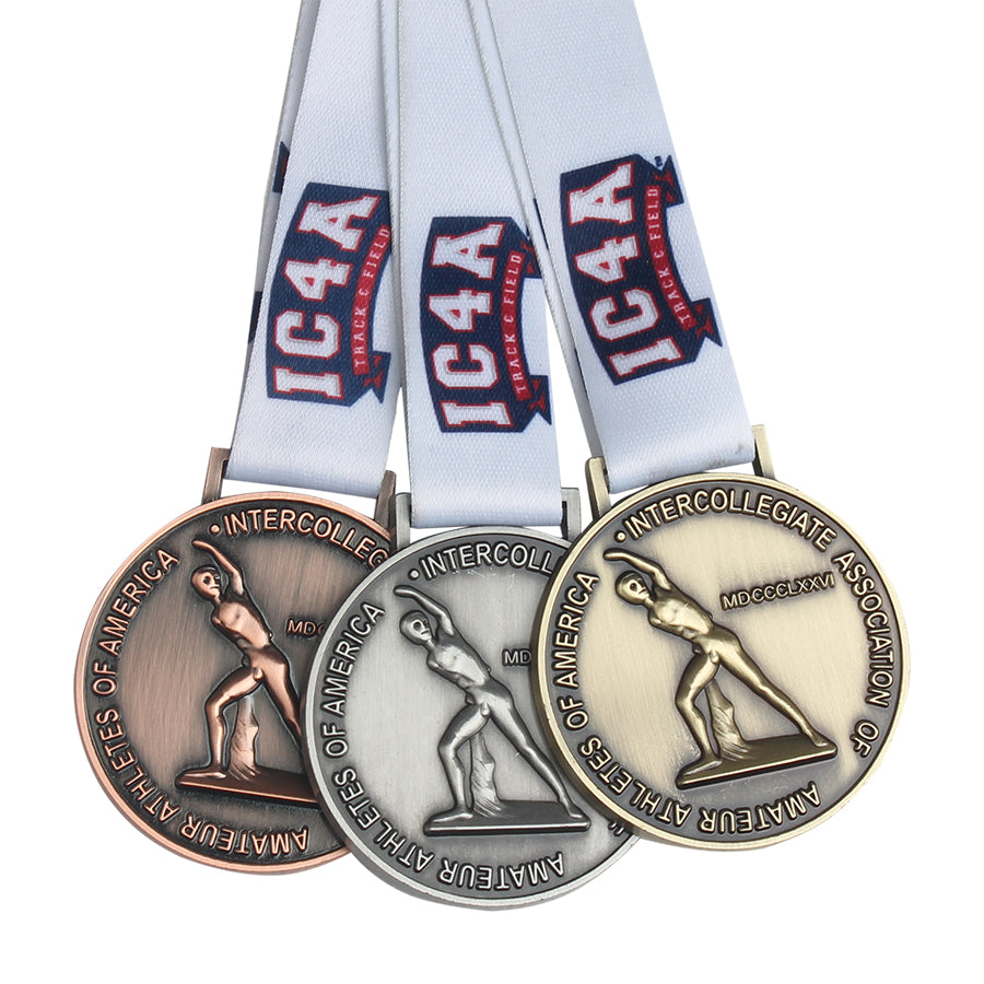A set of custom metal medals with ribbons, featuring various designs, awarded for a sporting event.