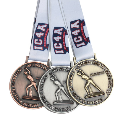 A set of custom metal medals with ribbons, featuring various designs, awarded for a sporting event.